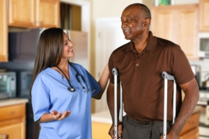 nurse taking care of elderly man